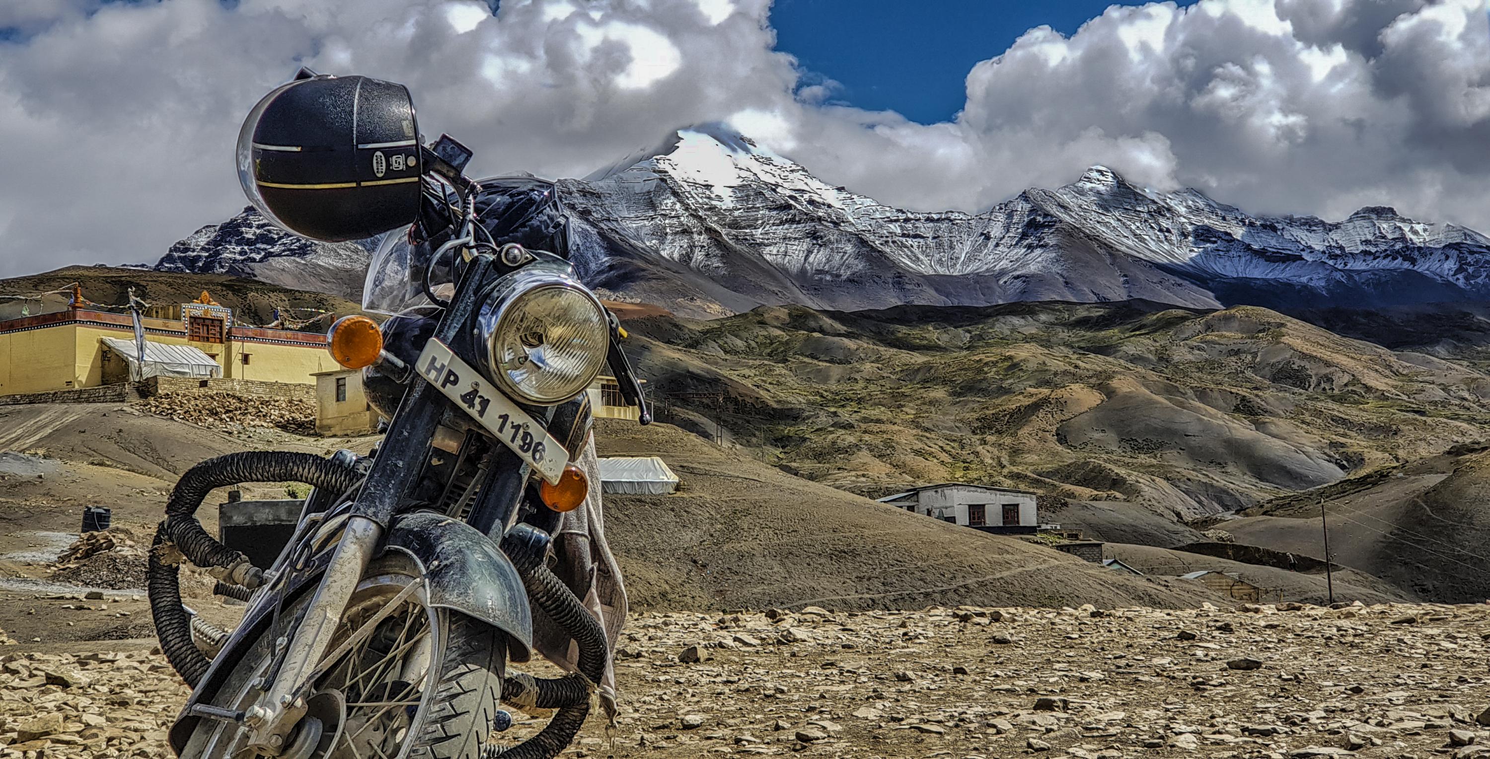 motorbike with mountain backdrop.