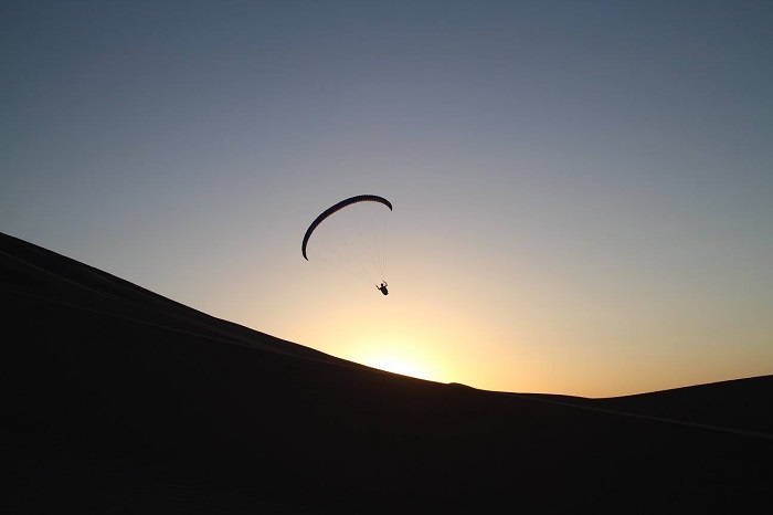 Sunset flight over the dunes