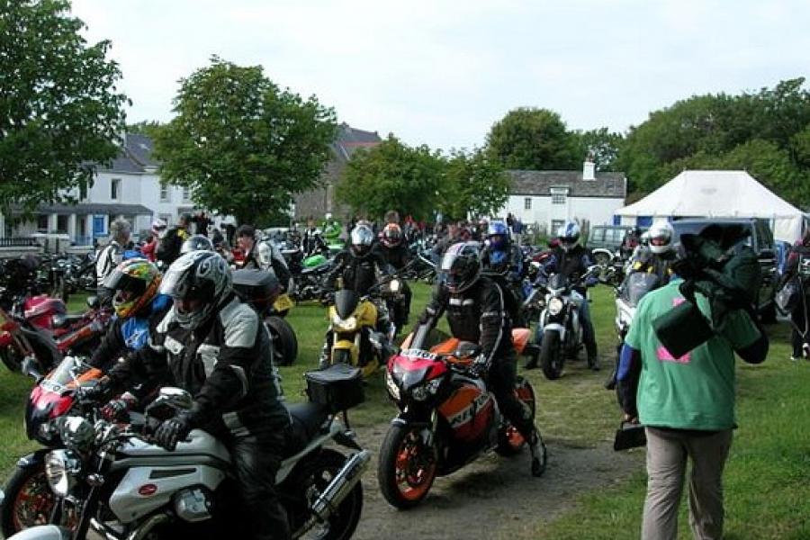 Bikes leave Kirk St Michael after the Senior race