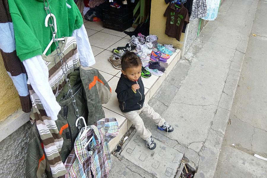 Huehuetenango, a little boy on shop steps