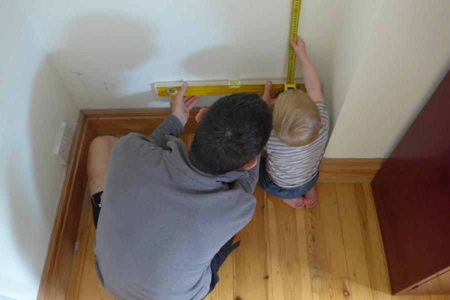 Mike and Conall measure up for shelves in London