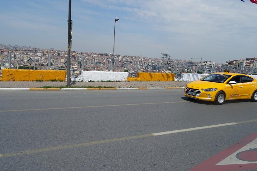 Yellow Taxi and vast city of Istanbul