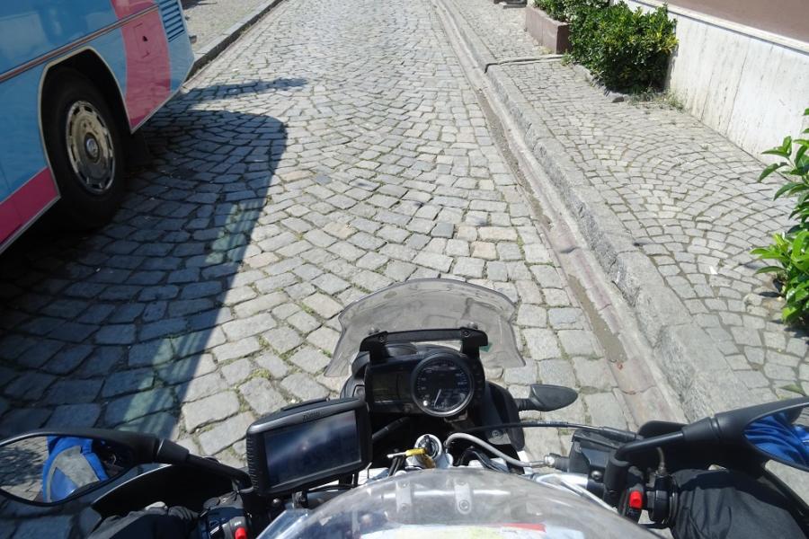 Pebble streets and bus and bike.