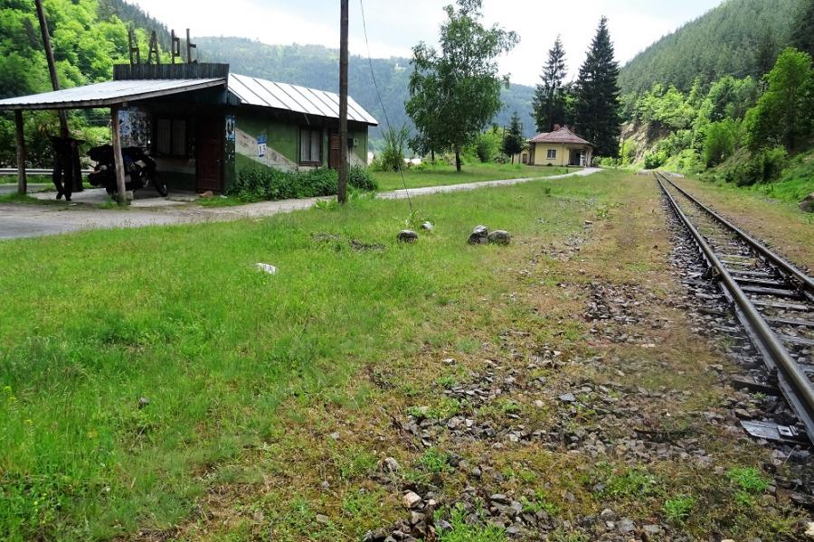 sheltering from the rain at the 'station'. Narrow gauge rail up the mountain pass