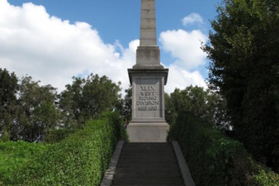 The 49th (West Riding) Division Memorial is located at the eastern boundary of Essex Farm cemetery on the western bank of the Ieper-Ijser canal.