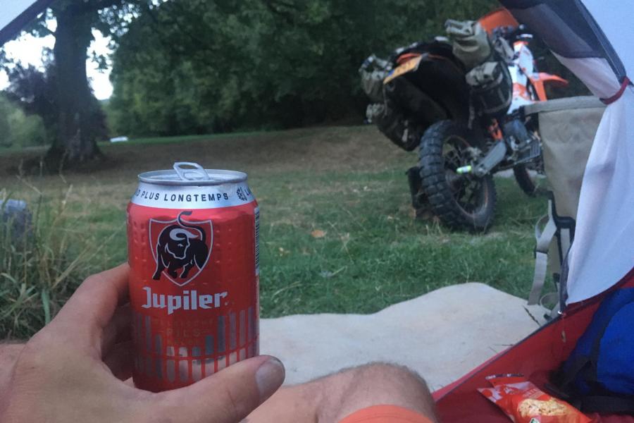 Sitting in my tent with a beer after a riding day.