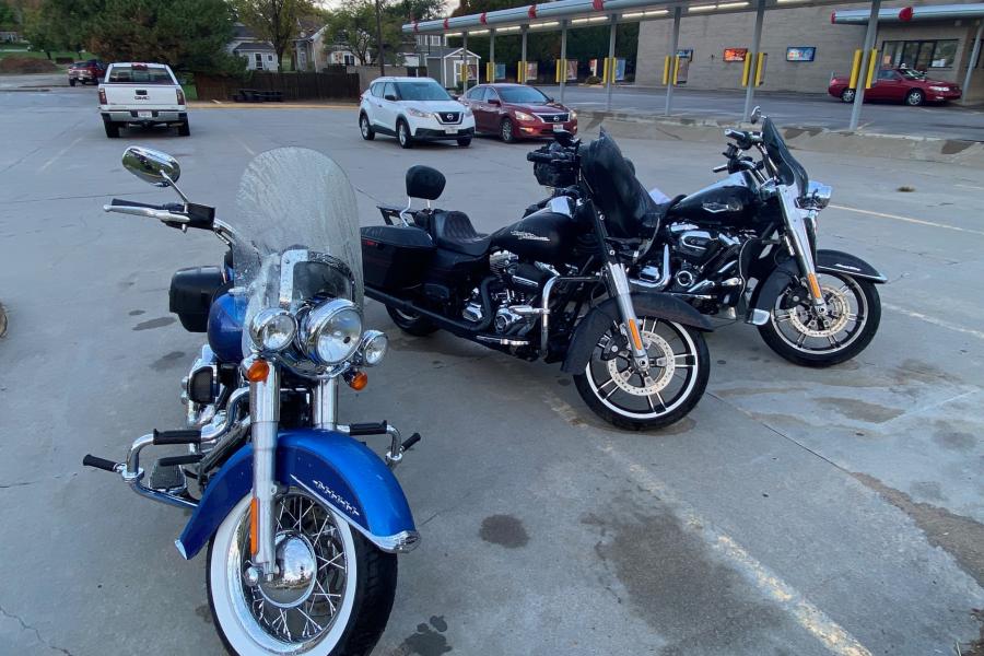 Three Harleys in Covington, Kansas.  The night before we rode thru the worst rain and hail storm I have encountered in 22 years of riding.  The blue Deluxe belongs to my sister, the black Street Glide belongs to my brother in law, and the black Road King on the far right is mine.  It is sure more comfortable than the BEAST.