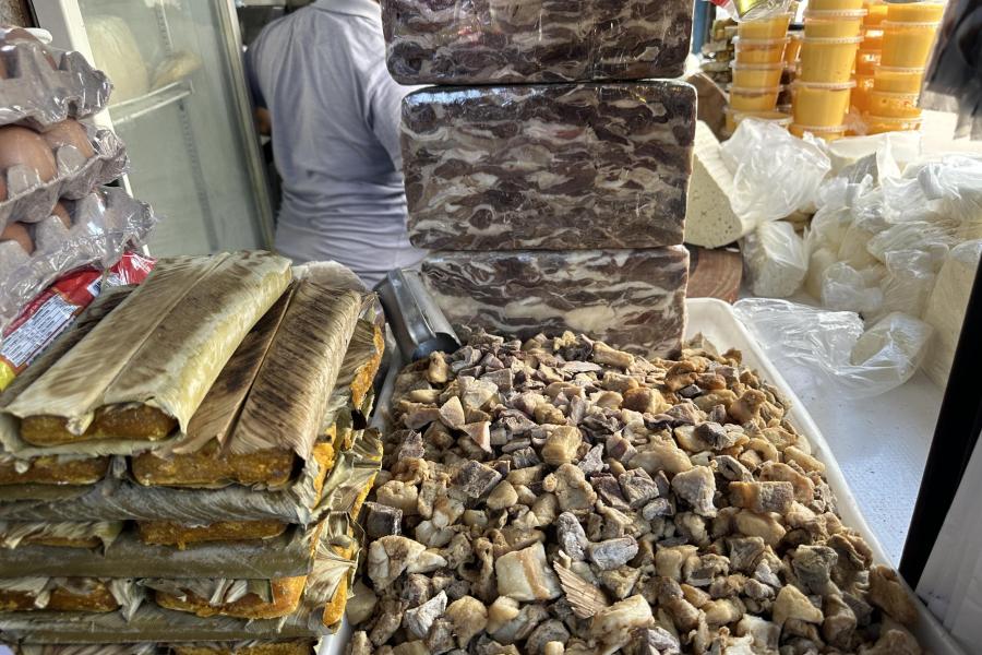 Meat and cheese market vendor