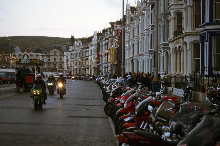 Streets of Doublas in the evening are full of bikes from all over the world - it's a show in itself. Photo copyright by Grant Johnson