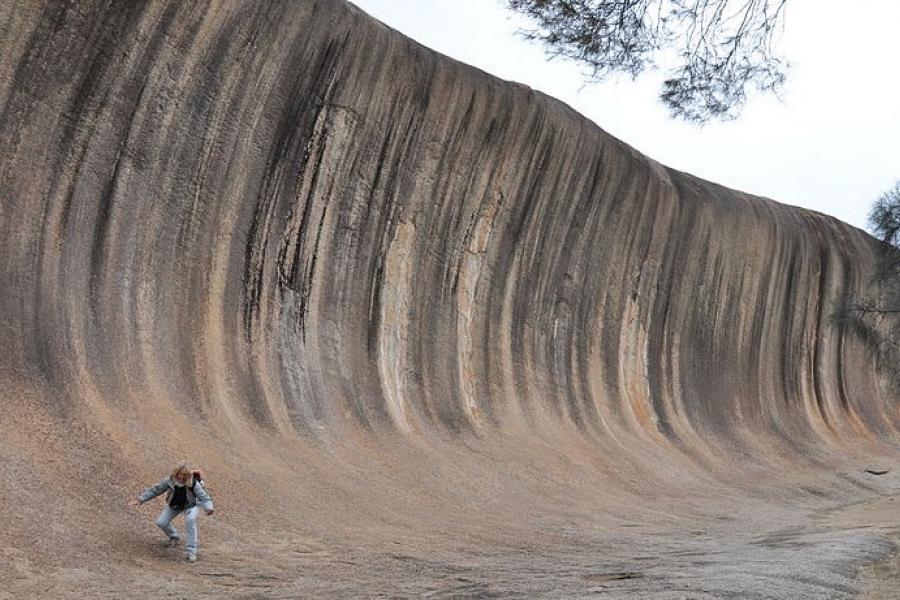 Person "surfing" the Wave Rock