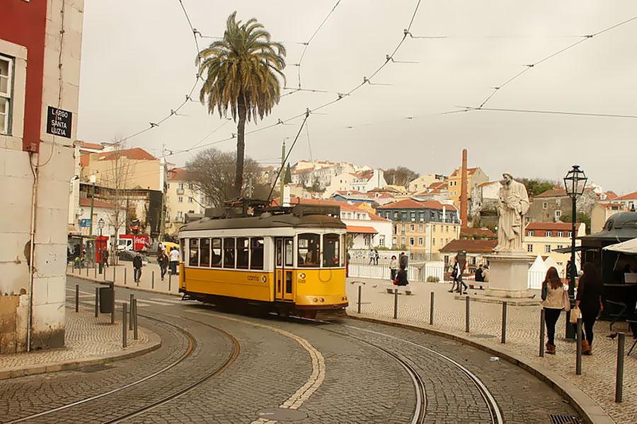 Lisbon Tram 28 coming around a curve in the road