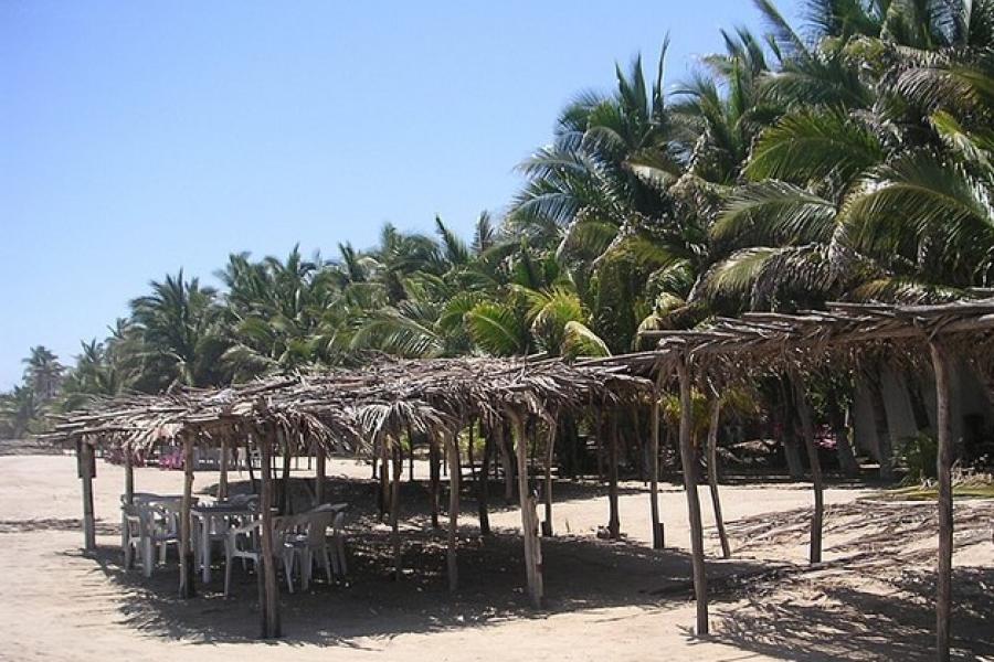 Shady straw and wood beach area, Tamarindo beach