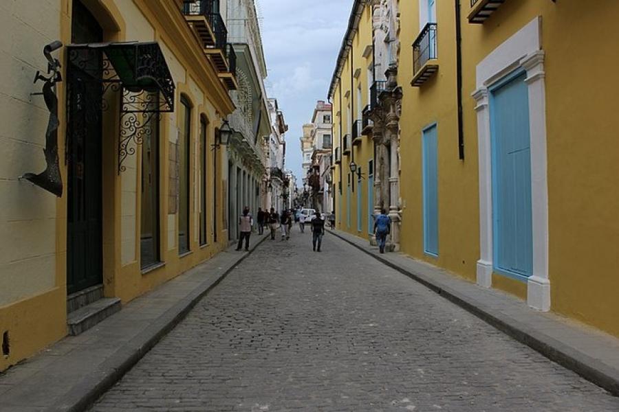 Cobblestoned sidestreet and yellow buildings, La Habana Viego (Old Havana), Cuba