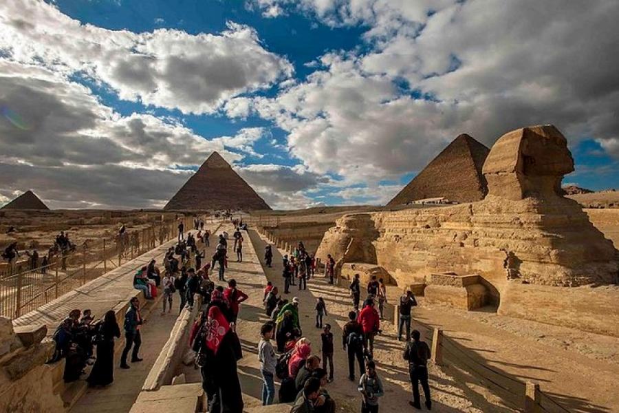 Tourists visit the Sphinx, Pyramids of Giza, Egypt