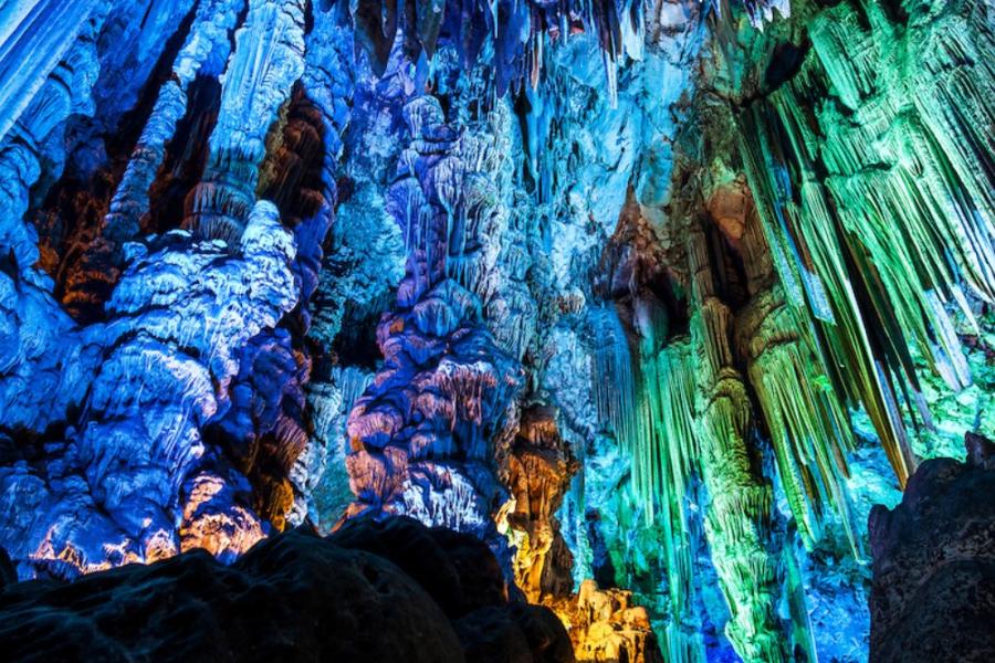 Stalactites lit by colourful lights, St. Michael's Cave, Gibraltar