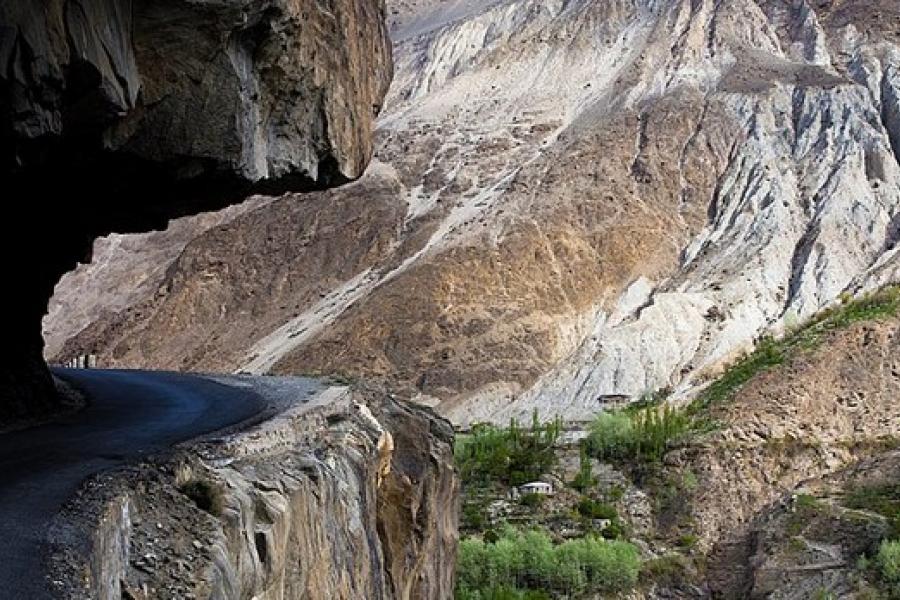 Karakoram Highway - A road undercut into a cliff with no barrier to prevent anything going over the edge.