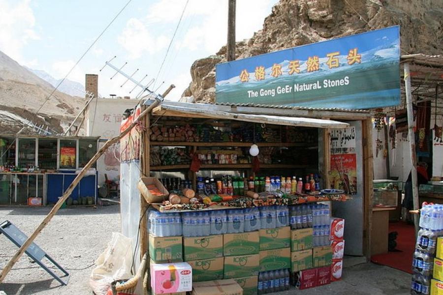 Karakoram Highway - A small roadside market stand selling bottled beverages, limited fruit, and dry goods.