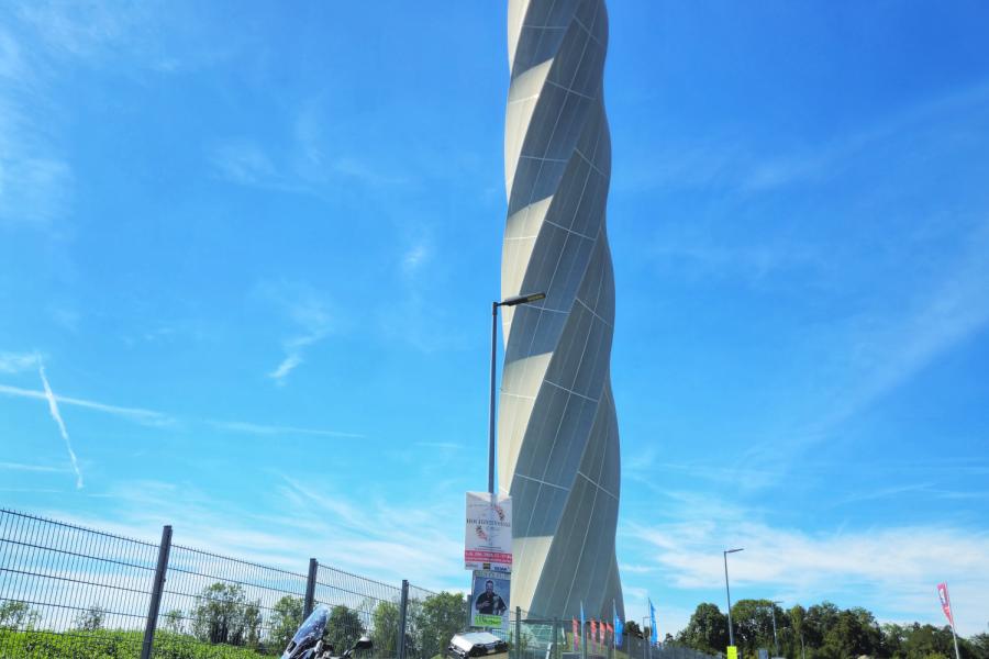 TKE Test Tower with motorcycle parked in front